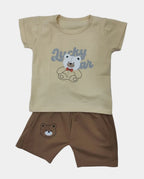 Children's outfit with beige t-shirt and brown shorts featuring bear graphics on a gray background
