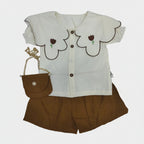Children's outfit with floral design on a white background