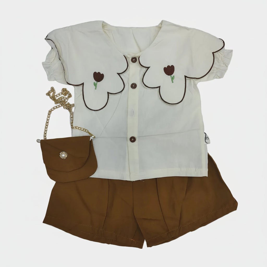 Children's outfit with floral design on a white background