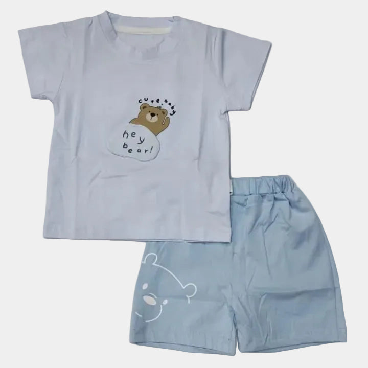 Children's blue t-shirt and shorts set with bear design on a light gray background