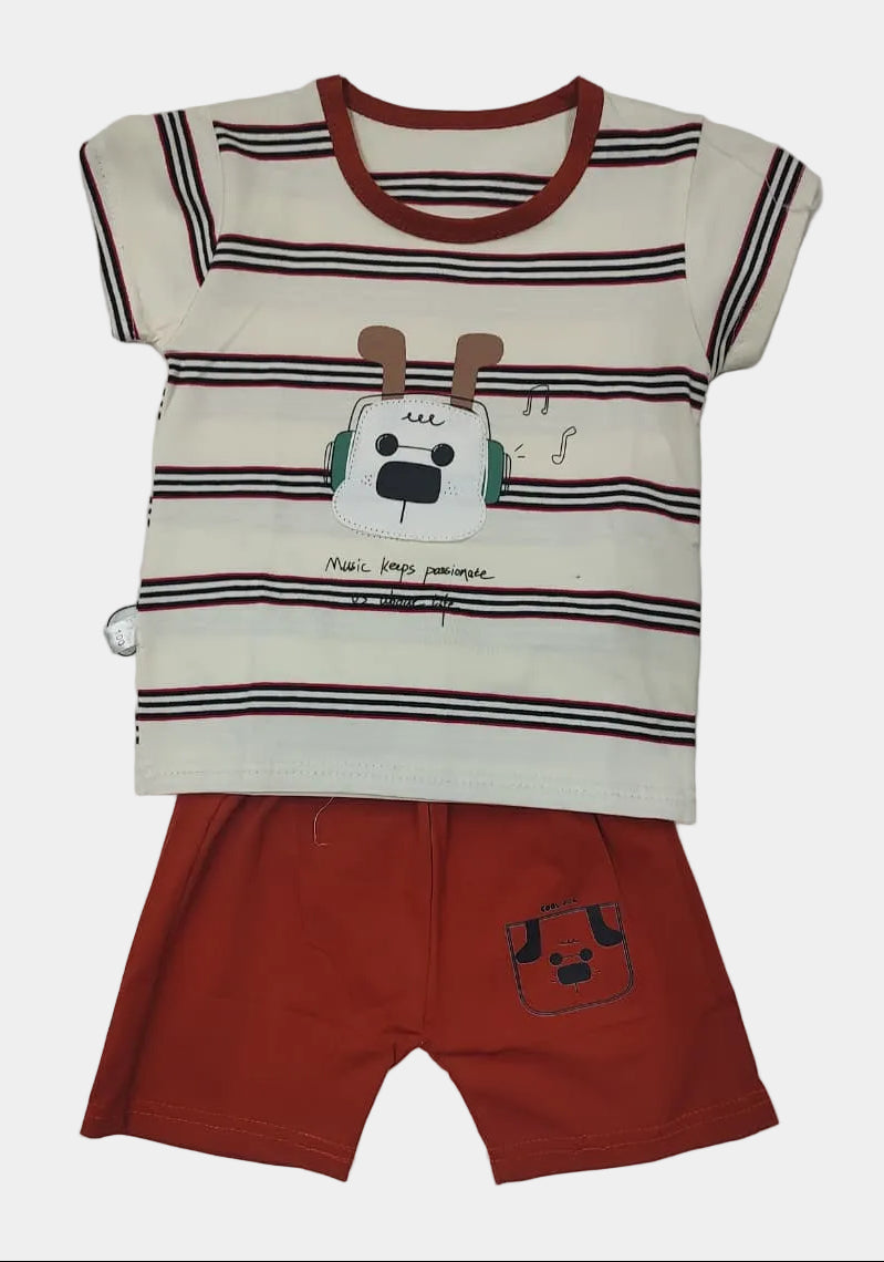 Children's outfit with striped shirt and red shorts on a gray background