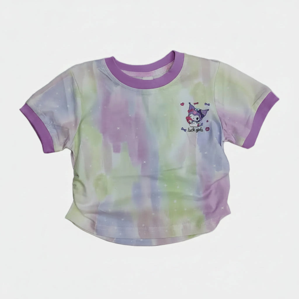 Colorful baby bib and shorts set on a white surface