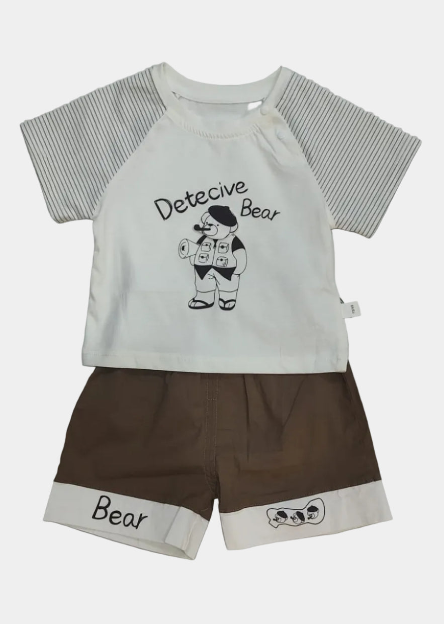 Children's outfit with t-shirt and shorts featuring 'Detective Bear' design on a light gray background