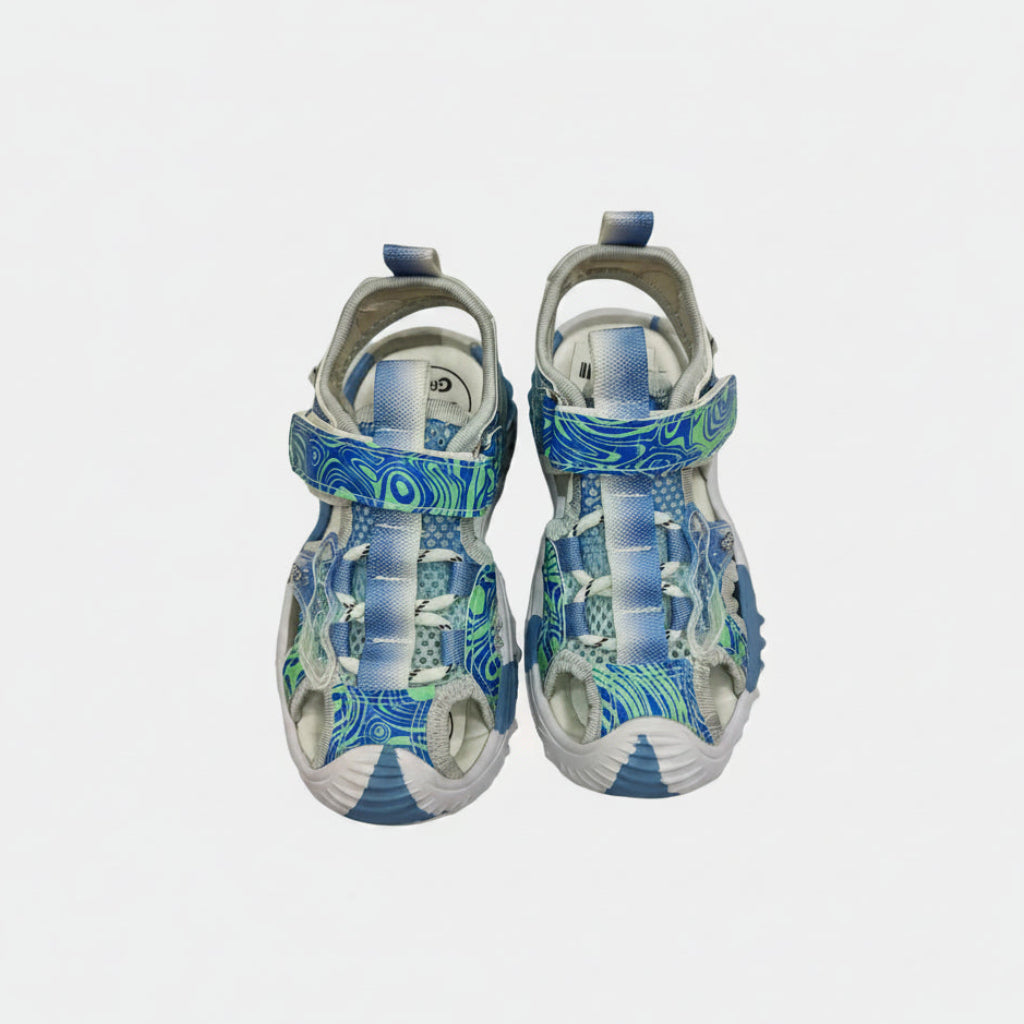 Pair of blue and gray sandals with a pattern on a white background