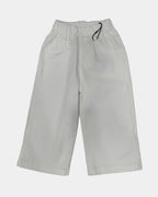 White pants on a light gray background
